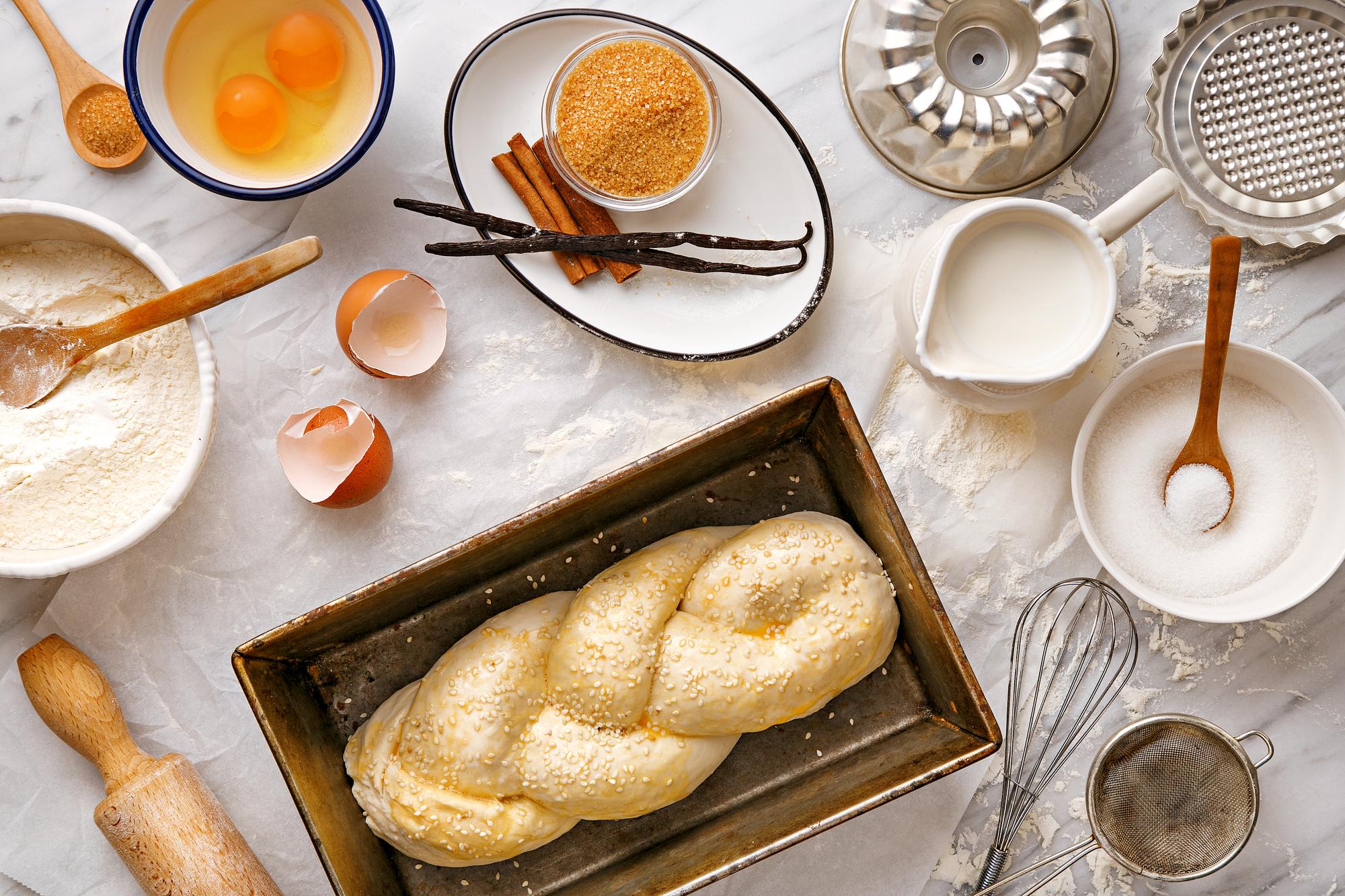 Small artisan bakery counter with pastries and recipe notes