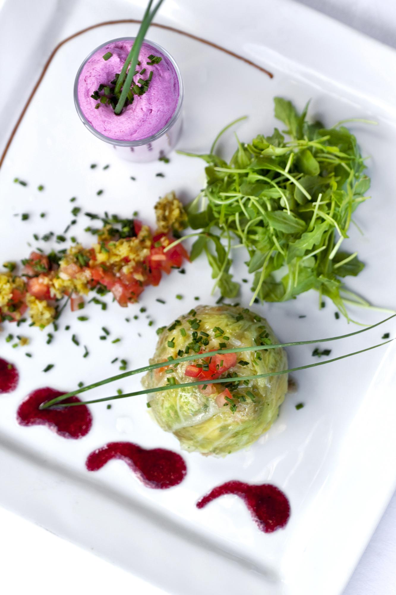 Plated vegetarian main with colorful garnish
